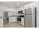 Modern kitchen with stainless steel appliances and granite counters at 8699 Bardmoor Blvd # 304, Seminole, FL 33777