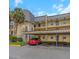 Exterior view of a condo building with parking at 8699 Bardmoor Blvd # 304, Seminole, FL 33777