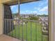 Screened balcony overlooking the community pool and grounds at 8699 Bardmoor Blvd # 304, Seminole, FL 33777