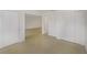 Bright interior hallway with tile floors and multiple doors leading to other rooms at 8699 Bardmoor Blvd # 304, Seminole, FL 33777