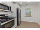 Modern kitchen with stainless steel appliances and granite countertops at 8699 Bardmoor Blvd # 304, Seminole, FL 33777