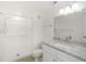 Bathroom features granite countertop, white cabinets, and shower/tub combo at 8699 Bardmoor Blvd # 304, Seminole, FL 33777