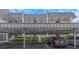 Covered parking area with multiple parking spots under building at 8699 Bardmoor Blvd # 304, Seminole, FL 33777