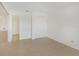 Bedroom with a double door closet and view of bathroom at 8699 Bardmoor Blvd # 304, Seminole, FL 33777