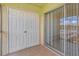 Balcony with double doors and sliding glass door at 8699 Bardmoor Blvd # 304, Seminole, FL 33777