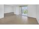 Open living area with tile floors and access to a balcony at 8699 Bardmoor Blvd # 304, Seminole, FL 33777