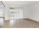 Bright living room with tile floors and sliding glass doors leading to a balcony at 8699 Bardmoor Blvd # 304, Seminole, FL 33777