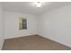 Empty bedroom with tiled floors and window with blinds at 8699 Bardmoor Blvd # 304, Seminole, FL 33777