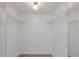 Large walk-in closet with wire shelving and mirrored doors at 8699 Bardmoor Blvd # 304, Seminole, FL 33777