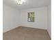Simple bedroom with tile flooring and a window with blinds at 8699 Bardmoor Blvd # 304, Seminole, FL 33777
