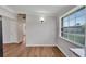 Simple dining area with wood-look floors and view to kitchen at 1317 Warrington Way, Tampa, FL 33619