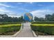 Landscaped community entrance with globe feature at 2310 Denmark St # 50, Clearwater, FL 33763