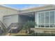 Condo building with modern glass facade and stairs at 2310 Denmark St # 50, Clearwater, FL 33763