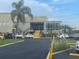 Condo building with glass entryway and parking area at 2310 Denmark St # 50, Clearwater, FL 33763