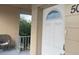 Unit entrance with white door and balcony view at 2310 Denmark St # 50, Clearwater, FL 33763