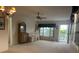 Spacious living room with large window and access to balcony at 2310 Denmark St # 50, Clearwater, FL 33763