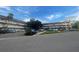 Two-story condo building with ample parking and lush landscaping at 2310 Denmark St # 50, Clearwater, FL 33763
