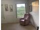 Relaxing bedroom with comfy recliner chair and window views at 2310 Denmark St # 50, Clearwater, FL 33763