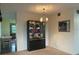 Dining area with built-in hutch and chandelier at 2310 Denmark St # 50, Clearwater, FL 33763