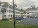 Two-story condo building with parking and lawn at 2310 Denmark St # 50, Clearwater, FL 33763