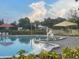 Community pool with ample deck space and lounge chairs at 2310 Denmark St # 50, Clearwater, FL 33763
