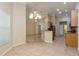 Bright kitchen area with tile flooring and a breakfast bar at 10538 San Travaso Dr, Tampa, FL 33647