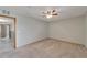 Empty bedroom with carpet, ceiling fan, and bright light at 609 Fox Hills Dr, Sun City Center, FL 33573