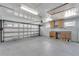 Organized garage with ample space, featuring built-in storage and work area for projects at 609 Fox Hills Dr, Sun City Center, FL 33573