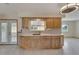 Bright, remodeled kitchen with custom cabinets, countertops, and stainless sink at 609 Fox Hills Dr, Sun City Center, FL 33573