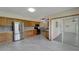 Spacious kitchen with stainless steel appliances, wooden cabinets and elegant tile flooring at 609 Fox Hills Dr, Sun City Center, FL 33573