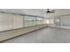 Sunroom with tile floor, windows and view, ceiling fan at 609 Fox Hills Dr, Sun City Center, FL 33573