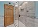 Large walk-in shower with glass enclosure and built in seat at 609 Fox Hills Dr, Sun City Center, FL 33573