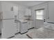 Laundry room with washer, dryer, and granite countertop at 609 Fox Hills Dr, Sun City Center, FL 33573