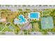 Aerial view of community amenities including pool, tennis courts, and playground at 7134 Heather Sound Loop, Wesley Chapel, FL 33545