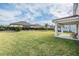 Private fenced backyard with a covered patio area perfect for relaxation at 7134 Heather Sound Loop, Wesley Chapel, FL 33545