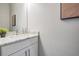 Modern bathroom vanity with marble countertop and single sink at 7134 Heather Sound Loop, Wesley Chapel, FL 33545