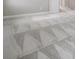 Empty bedroom with gray patterned carpet and white trim at 7134 Heather Sound Loop, Wesley Chapel, FL 33545