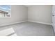 Spacious, unfurnished bedroom with gray carpet and ample natural light at 7134 Heather Sound Loop, Wesley Chapel, FL 33545