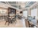 Clubhouse dining area with modern tables, chairs, and a serving counter at 7134 Heather Sound Loop, Wesley Chapel, FL 33545