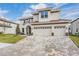 Beautiful curb appeal with a paver driveway and landscaped front yard at 7134 Heather Sound Loop, Wesley Chapel, FL 33545