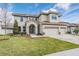 Two-story home with a tile roof, three-car garage, and landscaped yard at 7134 Heather Sound Loop, Wesley Chapel, FL 33545