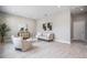 Spacious living room with neutral walls and modern light fixtures at 7134 Heather Sound Loop, Wesley Chapel, FL 33545