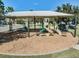 Community playground with slides, swings, and a shaded area at 7134 Heather Sound Loop, Wesley Chapel, FL 33545