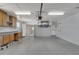 Garage with built-in cabinets and access to kitchen at 609 Fox Hills Dr, Sun City Center, FL 33573