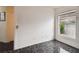 Empty spare room with tile floor and window overlooking backyard at 6108 Lanshire Dr, Tampa, FL 33634