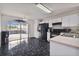Kitchen with access to a patio, black appliances, and a breakfast bar at 6108 Lanshire Dr, Tampa, FL 33634