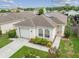 Aerial view of a single-story house with a garage and landscaped yard at 6108 Lanshire Dr, Tampa, FL 33634