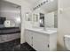 Clean bathroom with white vanity, large mirror and tiled floor at 6108 Lanshire Dr, Tampa, FL 33634