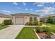 Single-story house with attached garage and landscaping at 6108 Lanshire Dr, Tampa, FL 33634