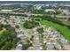 Aerial view of a residential neighborhood with houses, streets, and green spaces at 6108 Lanshire Dr, Tampa, FL 33634